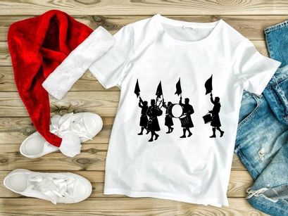 Scottish bagpiper band marching in traditional kilts with flags