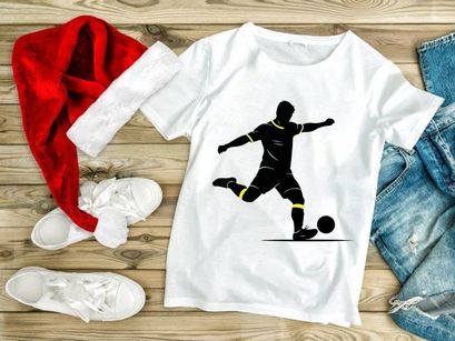 Soccer player kicking a ball in mid action with dynamic movement