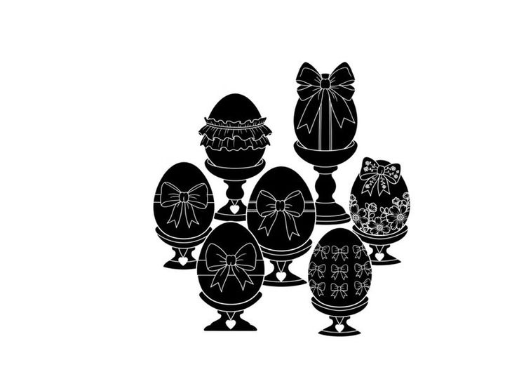 Easter eggs silhouette decorated with ribbons and bows on stands
