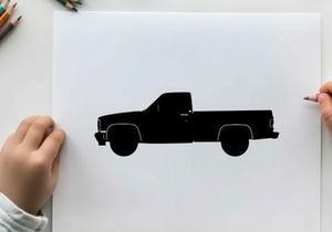 Silhouette of a classic pickup truck against a white background
