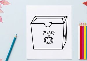Halloween candy gift box with pumpkin and ghost treats. Spooky party favor container for trick-or-treat handouts and celebrations.