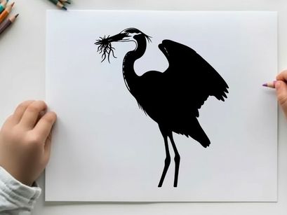 Silhouette of a heron building a nest with twigs and branches