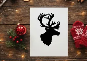 Black silhouette of a reindeer head with large antlers isolated on a white background.