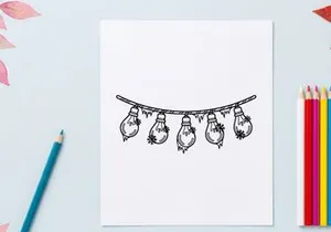 Hand drawn string of light bulbs with snowflakes and icicles