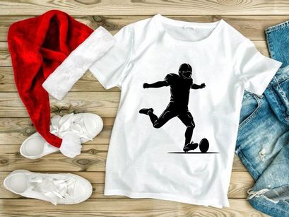 American football player kicking a ball in action silhouette