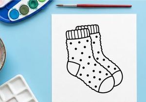 Pair of polka dot socks line art illustration for Christmas holiday design elements.