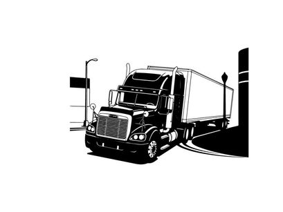 Silhouette of a semi truck parked near a loading dock at night