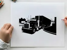 Silhouette of a semi truck on the road with trailer