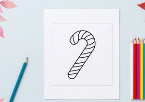 Candy cane line art illustration for Christmas holiday design and coloring page activity.