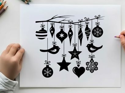 Christmas ornaments silhouette hanging from a tree branch