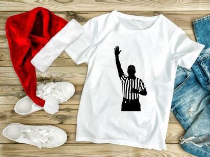 Referee in black and white silhouette signaling a call in sports