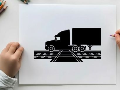 Silhouette of a semi truck on railroad tracks