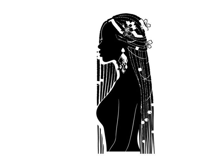Silhouette of a woman with long hair and ornaments