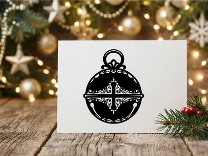 Schwarz-weißes Weihnachts-Glocken-Symbol mit verziertem Kreuz-Filigran-Design.