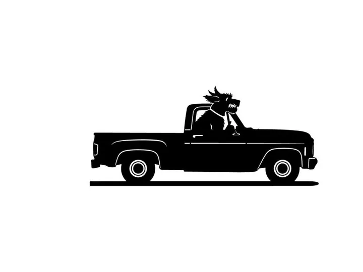 Silhouette of a dragon riding in a pickup truck