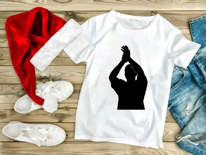 A person standing in a dynamic pose with arms raised above their head in silhouette