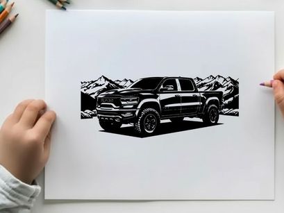 Silhouette of a pickup truck in front of mountains