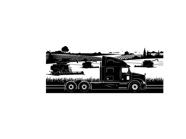 Silhouette of a semi truck driving through a rural landscape
