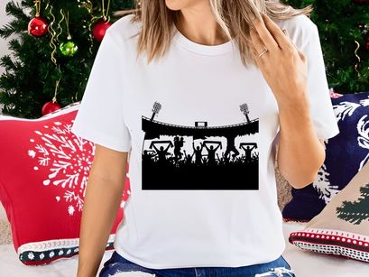 Silhouette of excited fans celebrating in a stadium with flags and lights