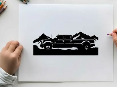 Black silhouette pickup truck in front of mountain range silhouette