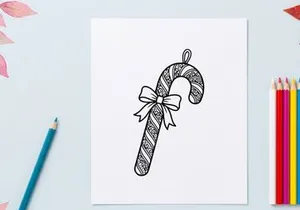 Christmas candy cane ornament with bow, hand drawn doodle style holiday illustration.