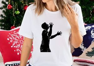 A silhouette of a man with hands raised in a gesture of praise or despair