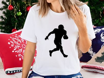American football player running with ball in hand silhouette