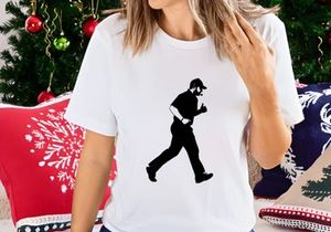 A man in a black outfit and cap running or jogging in a dynamic pose