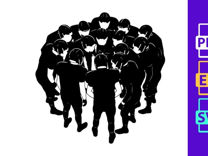 A group of football players in a huddle together on the field in black and white