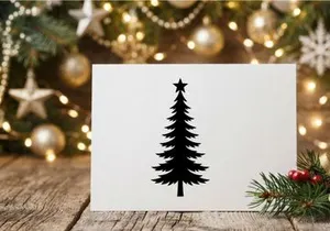 Black Christmas tree silhouette with a star topper isolated on a white background.