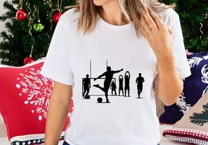 Silhouette of soccer players in action on the field with goalpost