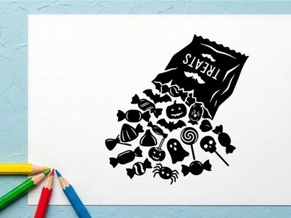Black and white coffee bag spilling coffee beans with flowers and spoon