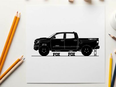 Silhouette of a black pickup truck with fox logo