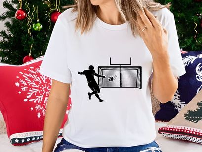 Soccer goalkeeper attempting to block a penalty shot in a football match