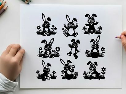 Black silhouette easter bunnies in flowers and grass