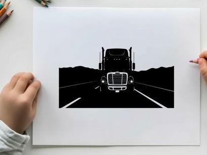 Silhouette of a semi truck driving on a highway