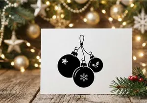 Black and white Christmas bauble ornaments icon with snowflake and star design