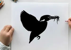 Silhouette of a bird in flight with twigs in its beak