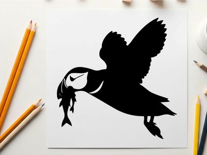 Silhouette of a puffin flying with a fish in its beak outdoors