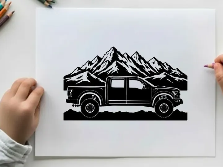 Silhouette of a pickup truck in front of majestic mountain range silhouette