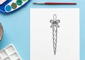 Christmas icicle ornament line art drawing with a decorative bow for holiday design