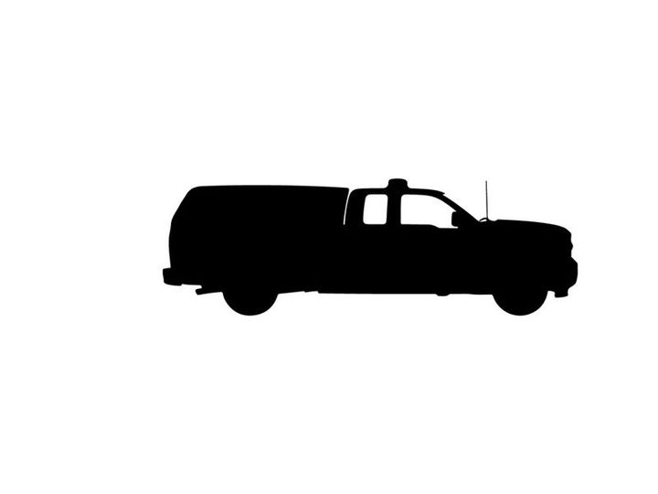 Silhouette of a pickup truck with a covered cargo bed