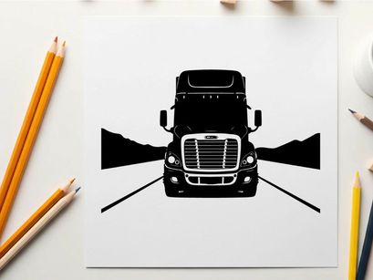 Silhouette of a semi truck on a highway with mountains