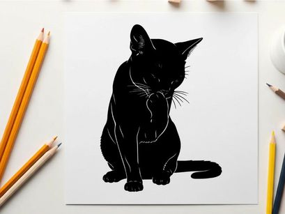 Silhouette of a black cat sitting and looking down