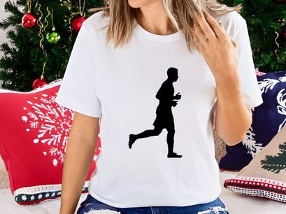 Silhouette of a man running in a dynamic pose with one leg extended