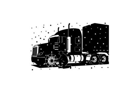 Silhouette of a semi truck driving in the snow