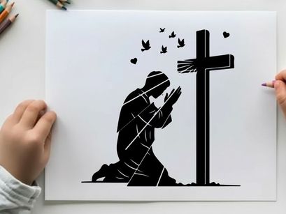 Silhouette of a person praying beside a cross silhouette