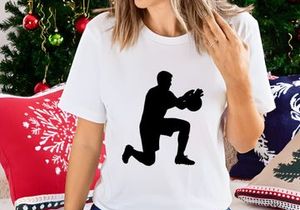 A silhouette of a man in a kneeling position throwing a ball