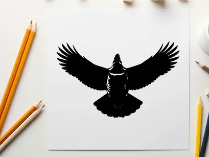 Silhouette of a bird with outstretched wings in flight