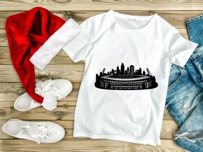 Black and white illustration of a city skyline with a large stadium